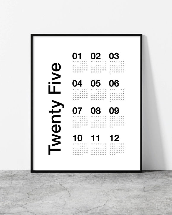 White 2025 wall calendar with bold black vertical text and a simple grid layout.