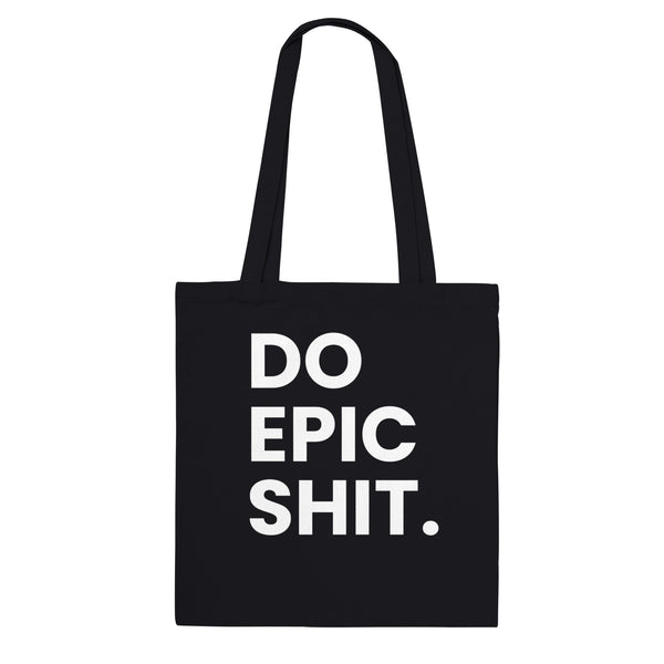 A black canvas tote bag designed by North Minimal featuring white letter text that reads "Do epic shit.". The image shows the front of the tote bag with the text centered and clearly visible on the black background.