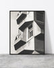 A photo print of a contemporary building in Copenhagen, designed by North Minimal, displayed in a black frame.