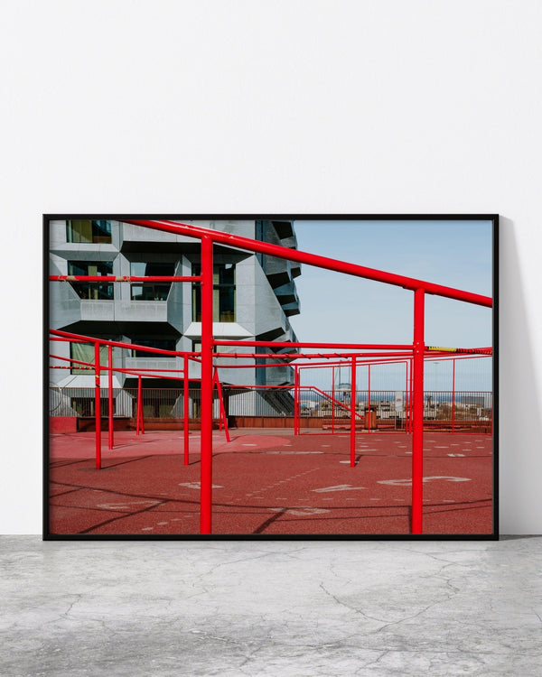 A modern architecture photo print in a black frame, designed by North Minimal and showcasing the stunning contemporary architecture of Copenhagen. The photograph captures the sleek lines and geometric shapes of a unique building, with a minimalist design that emphasizes the beauty of simplicity. 